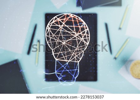 Double exposure of creative light bulb hologram and digital tablet on background, top view, research and development concept