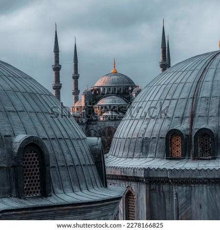 View of Sultanahmet Imperial Mosque (Sultan Ahmet Cami), also known as the Blue Mosque domes and minarets in Istanbul, Turkey at sunset. Built in the 17th century by the architect Mehmet Royalty-Free Stock Photo #2278166825