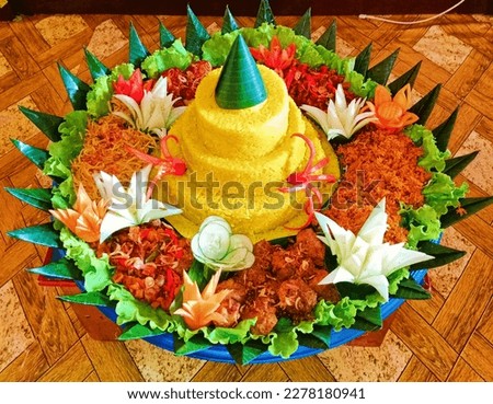 Nasi Tumpeng (cone-shaped rice) from Indonesia Royalty-Free Stock Photo #2278180941
