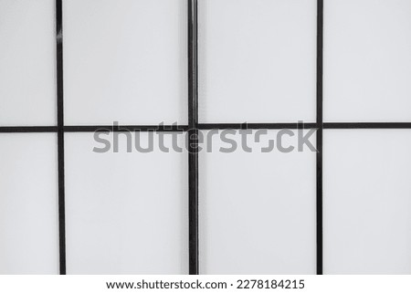 Black and white or black-gray background with squares and rectangles.