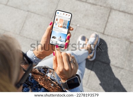 Woman using social media app on mobile phone Royalty-Free Stock Photo #2278193579