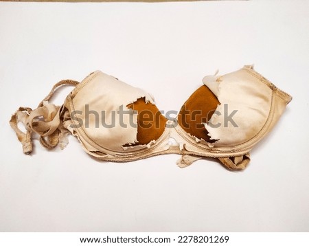 Worn and broken women's underwear bra