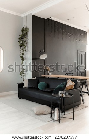 Black leather sofa in the interior