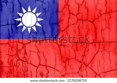 Flag of Taiwan on cracked wall, textured background.