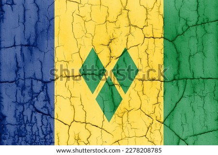 Flag of Saint Vincent and the Grenadines on cracked wall, textured background.