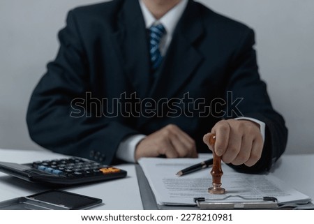 Contract law or paper work business and finance document rubber stamp. For official and legal contracts and agreements, financial statements, investment contracts, real estate documents.
