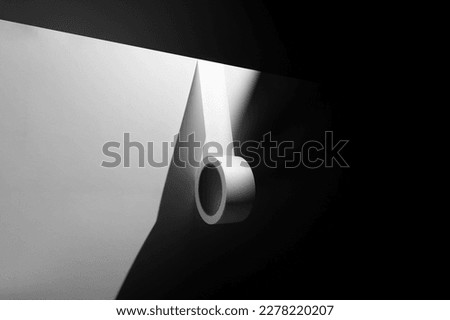 Duct tape mockup template on a wall side, deep shadows, real photo. Isolated surface to place your design. 
