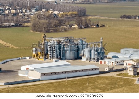 aerial view of agro-industrial complex with silos and grain drying line
