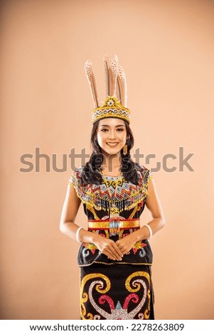 asian woman in king bibinge standing forward and put her hands in front of her body on isolated background