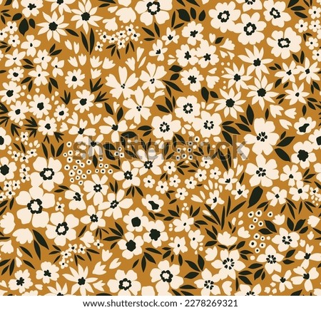 Vector seamless pattern. Pretty pattern in small flowers. Small white flowers. Gold mustard background. Ditsy floral background. Vintage stylish template for fashion prints. Stock vector. Royalty-Free Stock Photo #2278269321