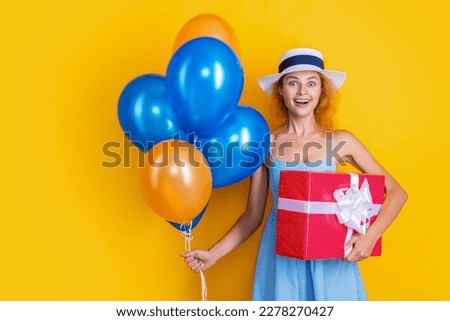 birthday woman with present isolated on yellow, copy space. birthday woman with present