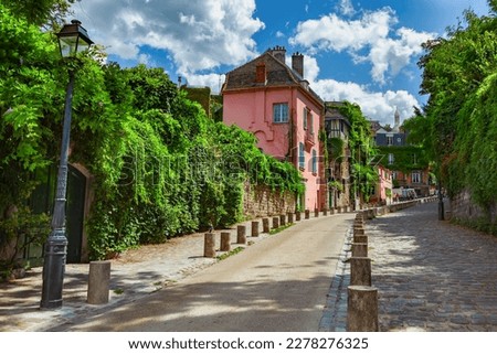 Street in quarter Montmartre in Paris, France. Royalty-Free Stock Photo #2278276325
