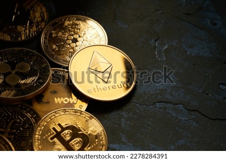 Various golden cryptocurrencies highlighting Ethereum coin with dark textured background