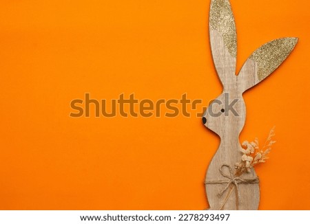 easter bunny on an orange background (Easter)