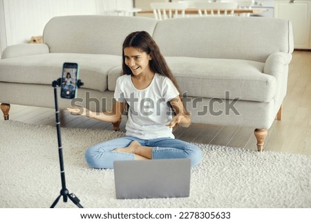 Cute preteen 12s girl blogger record video for vlog, make call, lead stream with friends use modern tech. Streamer activity, igeneration Z, fun and home use internet. Hobby, remote communication Royalty-Free Stock Photo #2278305633