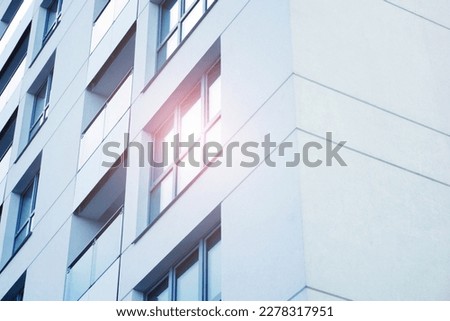 Office block texture. Glass skyscraper background. Glass window building. Sunny day architecture. Window sunlight reflection. Business building pattern.