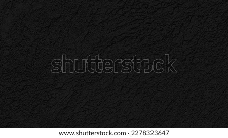 Cement wall panorama painted black with rough lines texture and seamless background. Texture of black plaster. Dark rough surface. Background texture of grunge brick wall in industrial loft style