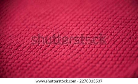 Grid relief in red cotton fabric