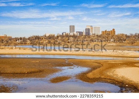Sunny view of the skyline of Tulsa city from River West Festival Park at Oklahoma