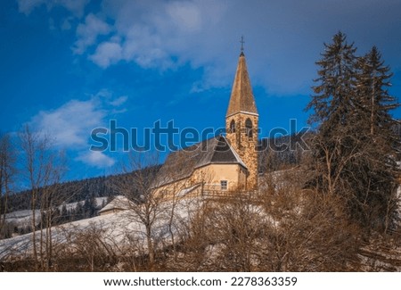Small church in St. Magdalena or Santa Maddalena in Geislergruppe or Gruppo dele Odle Italian Dolomites Alps mountains. January 2023 Royalty-Free Stock Photo #2278363359