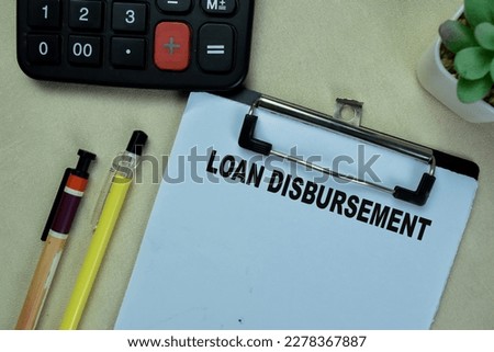 Concept of Loan Disbursement write on paperwork isolated on Wooden Table.