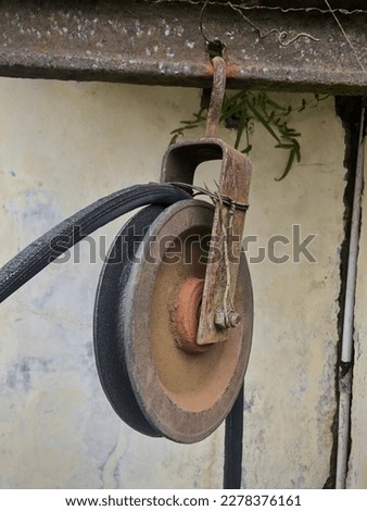 A pulley is a wheel on top of an axle or wheel drive designed to support the movement and change the direction of the attached belt, or transfer force between the wheel drive and the cable or belt.