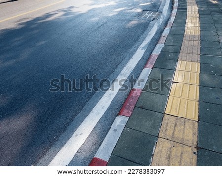 Road with traffic signs, sidewalk signs