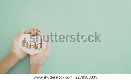 Hands holding diversity family in heart shape, happy carer and volunteer, disable nursing home, rehabilitation and health insurance concept Royalty-Free Stock Photo #2278388333