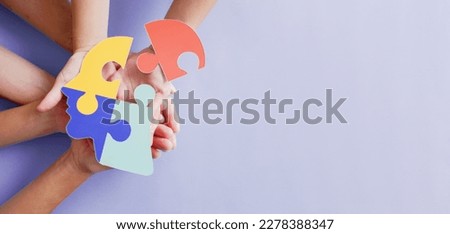 Hands holding jigsaw puzzle head shape, Autism awareness, Autism spectrum disorder (ASD), World Autism Awareness Day Royalty-Free Stock Photo #2278388347