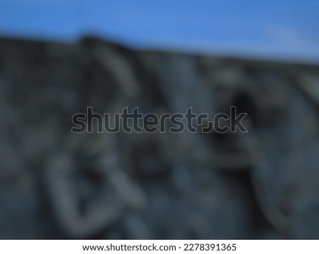 defocused photo of the statue on the wall