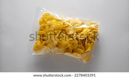 A Package of Banana Chips on the Isolated Background Royalty-Free Stock Photo #2278403391