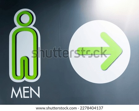 Arrow of public male toilet sign wall. Toilet sign. Restroom Concept.