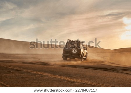 Driving Off Road At A Desert  Royalty-Free Stock Photo #2278409117
