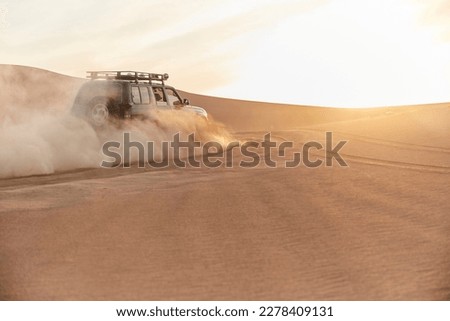 Driving Off Road At A Desert  Royalty-Free Stock Photo #2278409131