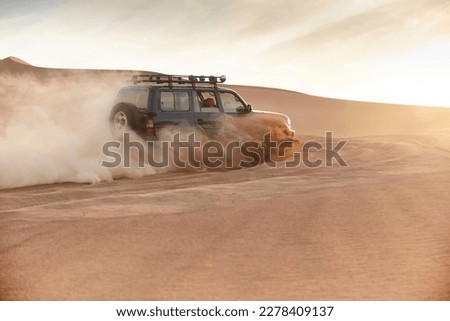 Driving Off Road At A Desert 