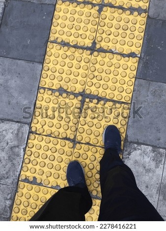 Special yellow lane for pedestrians with disabilities 