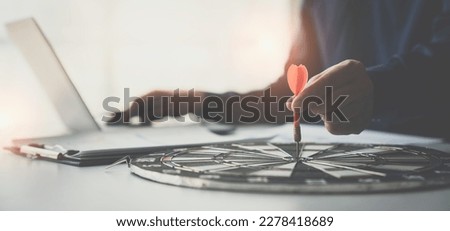 Businessman making business plans and strategies to achieve business goals. The financial income of the year is organized and determined. To reach 100% of customers. Management concept. Royalty-Free Stock Photo #2278418689