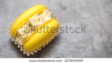 yellow beautiful macarons cookies on the table. home bakery concept.