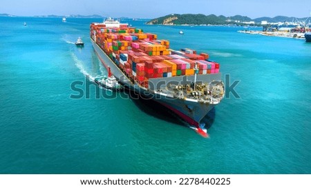 Aerial in front view of cargo ship carrying container and running for export goods from cargo yard port to customs ocean concept technology transportation , customs clearance.