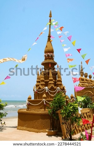 sand pagoda and little top pagoda  in Songkran festival represents In order to take the sand scraps attached to the feet from the temple to return the temple in the shape of a sand pagoda