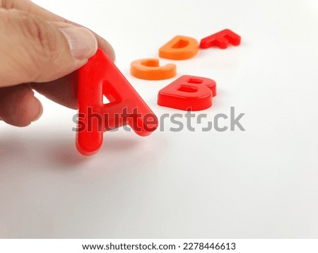 choose A letter by hand, Abstract best choice conceptual photo,A alphabet on white background 