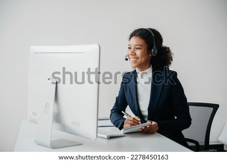 Serious call center operator in wireless headset talking with customer, woman in headphones with microphone consulting client on phone in customer support service in business center


 Royalty-Free Stock Photo #2278450163
