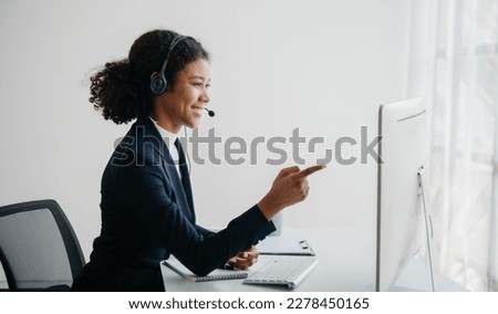 Serious call center operator in wireless headset talking with customer, woman in headphones with microphone consulting client on phone in customer support service in business center


 Royalty-Free Stock Photo #2278450165