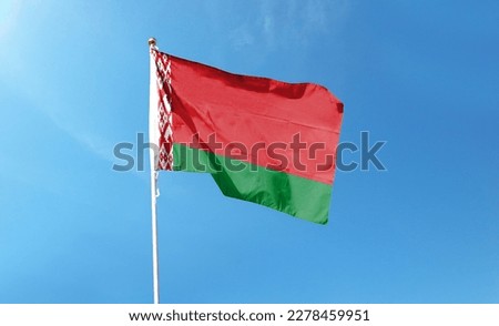 Belarus flag on cloudy sky. waving in the sky