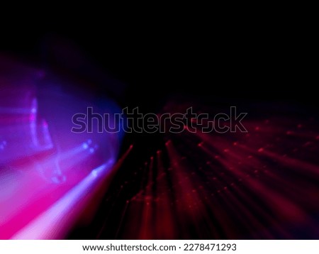 Blurred pink and rad blue light in darkness for electric energy concept abstract background
