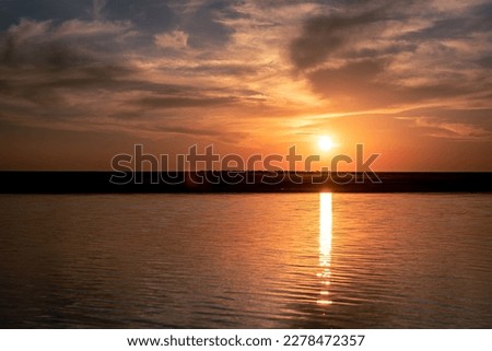 sunset on the shore of the lake