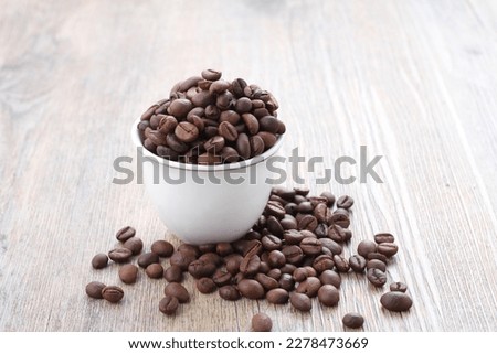 A coffee bean is a seed of the Coffea plant and the source for coffee. It is the pip inside the red or purple fruit. This fruit is often referred to as a coffee cherry.