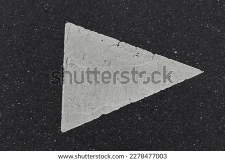 a road sign on a black asphalt road images
