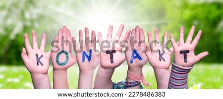 Children Hands Building Word Kontakt Means Contact, Grass Meadow