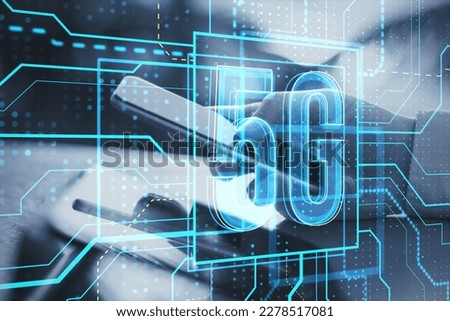 Close up of hand using cellphone or tablet with glowing linear 5g hologram on blurry background. 5G network and wireless systems. Double exposure